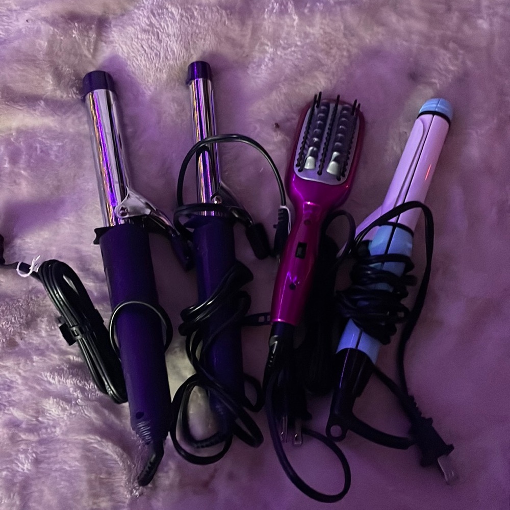 2 size curling irons, a straightener/curling iron mix,n hair brush straightener